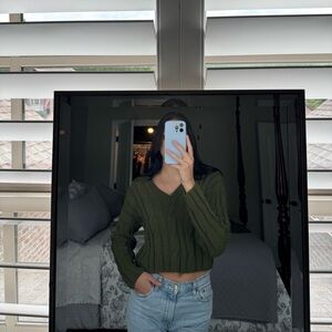 Green cable knit sweater